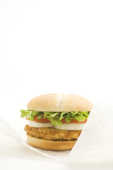 crisp chicken burger with tomato onion cheese lettuce