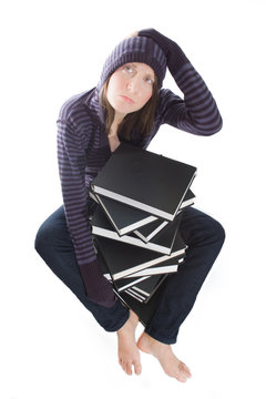confused woman with stack of books