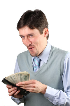 ..Photo of happy man holding packs of dollars in hands