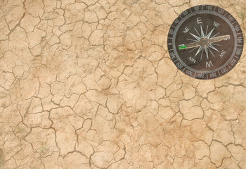 Fototapeta na wymiar Transparent background (dry earth and a compass)