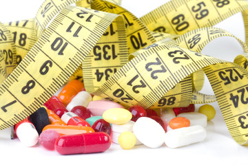 Measure tape with diet pills