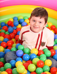 Fototapeta na wymiar Birthday of boy in color balls.