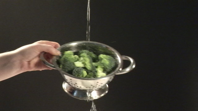 Washing broccoli with water