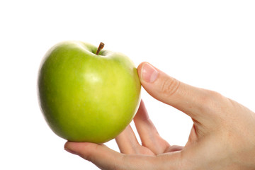 Green apple in a hand
