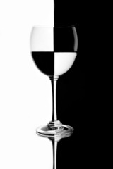 Optical Illusion of Half Filled Wine Glass Against Contrasting Background