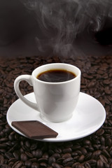 white porcelain coffee cup and chocolate