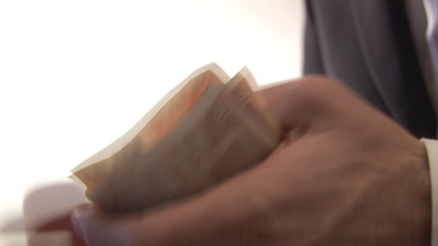 Stock Footage of a Man Counting Money