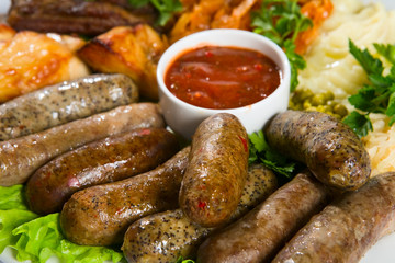 Grilled sausage with sauce and vegetables