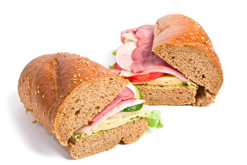 two halves of long whole wheat baguette sandwich