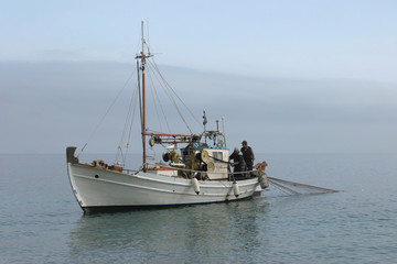 Naklejka na ściany i meble Fishing boat at work