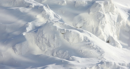Fototapeta na wymiar White snow mountains on the bright sun