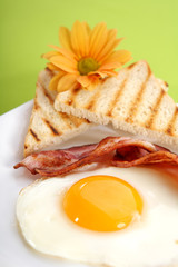 Breakfast - toasts, eggs, bacon