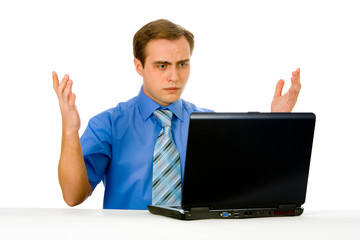 Young businessman working on a laptop. Isolated on white.