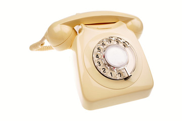 Rotary dial telephone on white