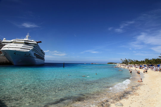 Cruise ship docked in tropical island beach port