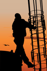 Vector silhouette of construction worker against sunset sky