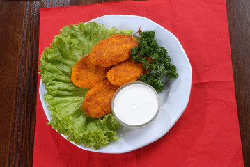 a plate of tasty chops served with sauce