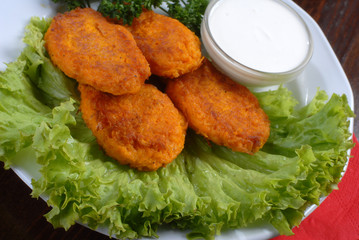 a plate of tasty chops served with sauce