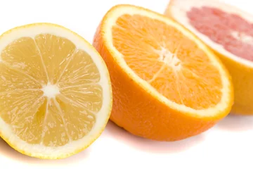 Cercles muraux Tranches de fruits citron, orange et pamplemousse