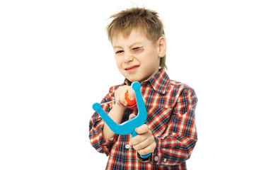 little boy with a slingshot