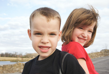 Two Children Smile for the Camera