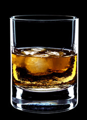 glass of whiskey and ice isolated over a black background