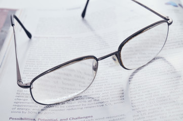 Reading glasses and magazine