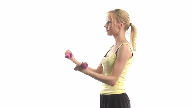 Stock Video Footage of a girl exercising with dumbells