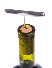 close-up corkscrew in wine bottle