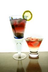 cocktail drinks in two different water glasses
