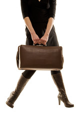 brown leather old vintage luggage bag/briefcase hold by a woman