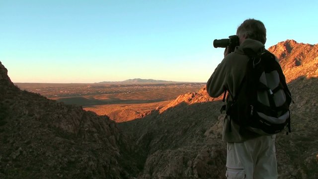 Photographer in desert landscape - HD