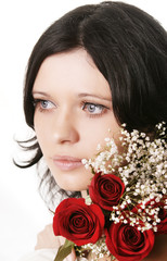 Beautiful brunette girl with a rose