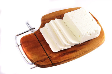 white goat cheese and slice on wooden plate