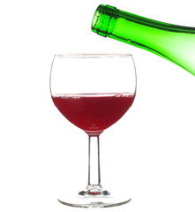 Wineglass and bottle of red wine isolated on white