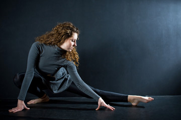 ballerina stretching in studio