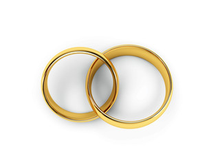 Wedding golden rings one over another. Isolated
