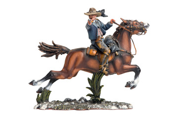 Fototapeta premium Little metllic cowboy shot on white