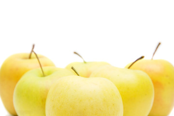 lots of yellow apples isolated on white