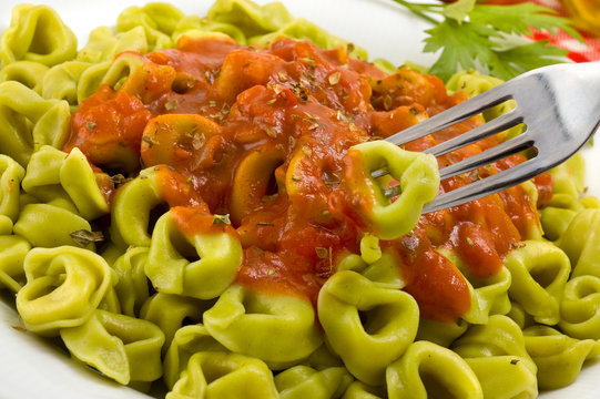 Tortellini with tomato sauce.
