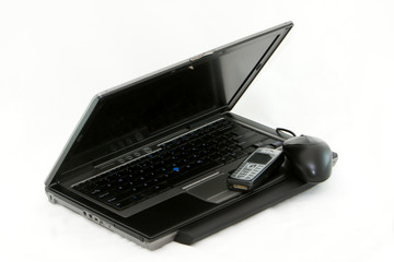 Laptop and phone on a whote background.