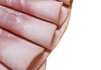 Slices of tasty ham on white dish. Shallow depth of field