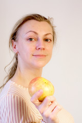 The woman with an apple in a hand