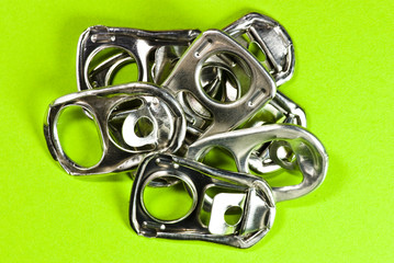 ring pulls on green background