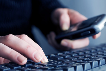 Female hands typing.