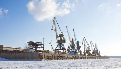 Fototapeta na wymiar Port cranes in winter port