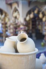 Traditional Eastern market with ceramic water pots.