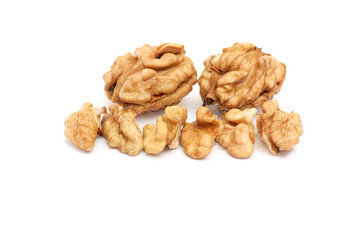 Pieces of walnuts on a white.