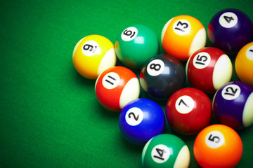 billiard balls on green cloth