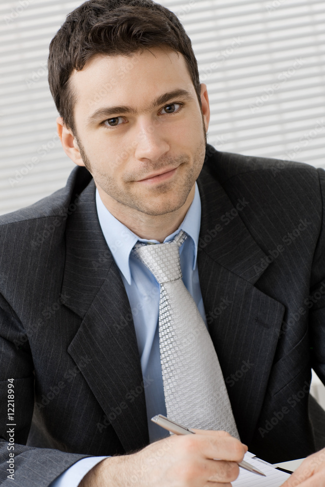 Poster portrait of smiling businessman